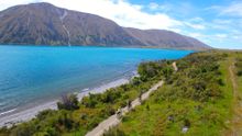 Cycling along the striking Lake Ohau