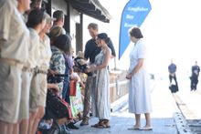 Harry and Meghan meeting with locals along the Kingfisher Bay Resort jetty