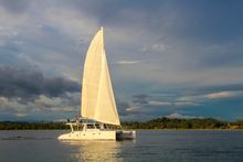 Sunset casts its glow on a live-aboard catamaran on tour in Sri Lanka with G Adventures