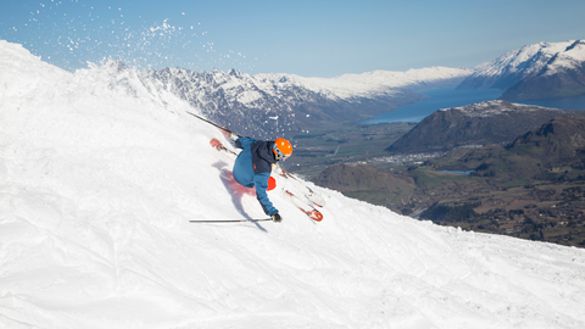 Skiing at Coronet Peak with Queenstown in the background. Credit: Neil Kerr