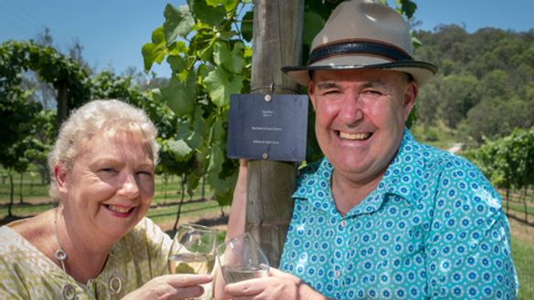 GC2018 volunteer Mark Grant and his wife Allison at their name-plated row of Semillon grapes at O'Reilly's Vineyard in the Gold Coast Hinterland.