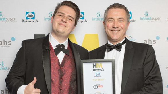 Justin McConnell, Hotel Manager, Next Hotel Brisbane (l.h.s.) receiving Best Tech Hotel from Brandon Evertz, CEO Big Review TV