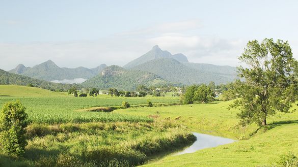 The tranquil Tweed River winds around the base of Mt  Warning in the Tweed Valley of northern NSW