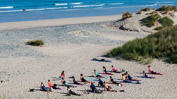 Yoga on the beach delivered by Alicia Ray Wellbeing