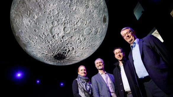 Canberra Moon Rock Trail Questacon’s Stephanie Hodge, NMA’s Robert Bunzli, Geoscience Australia’s Steve Petkovski and Dr Ed Kruzins, Director of the Canberra Deep Space Communication Complex stand under the giant moon in Questacon’s The Moon exhibit galle Canberra Moon Rock Trail Questacon’s Stephanie Hodge, NMA’s Robert Bunzli, Geoscience Australia’s Steve Petkovski and Dr Ed Kruzins, Director of the Canberra Deep Space Communication Complex stand under the giant moon in Questacon’s The Moon exhibit galle