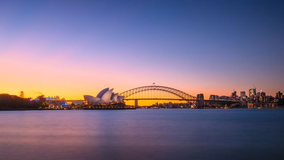 Sun setting over the Sydney Opera House and the Sydney Harbour Bridge, Sydney