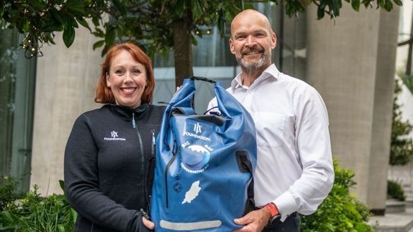 Marine biologist and broadcaster, Monty Halls stands with Chloe Couchman EVP of Comms for HX and HX Foundation board member to launch The Big Blue Bag project pilot.