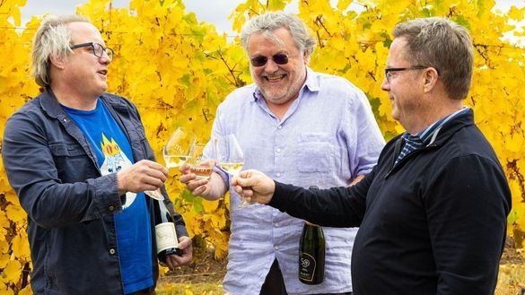 Sean O'Keefe, Larry Mawby, and Eddie O'Keefe Jr., toast 50 years of winemaking in Traverse City