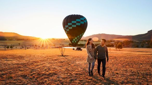 Couple arriving for a sunrise hot air balloon ride with Beyond Ballooning in the Hunter Valley Couple arriving for a sunrise hot air balloon ride with Beyond Ballooning in the Hunter Valley
