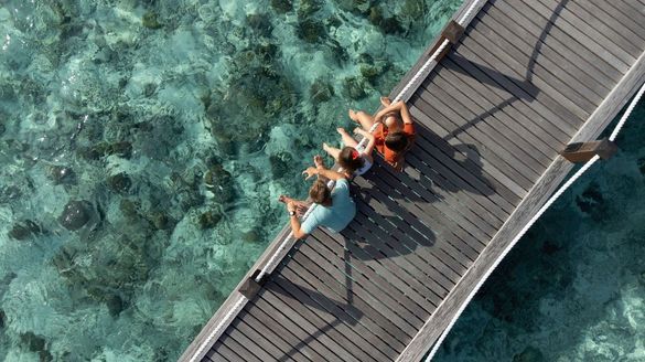 Sheraton Maldives Full Moon Resort & Spa - Family on a bridge Sheraton Maldives Full Moon Resort & Spa - Family on a bridge