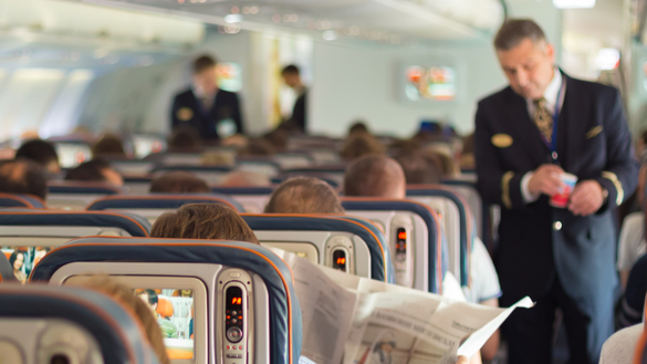 Passengers seated on a commercial airplane.