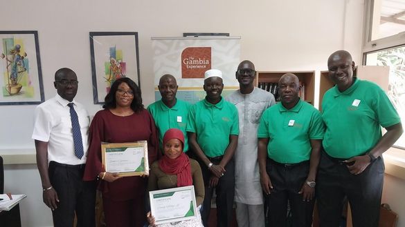 The Gambia Experience resort staff receiving CAPED certificates from Mr Momodou Bah (third from right).   
